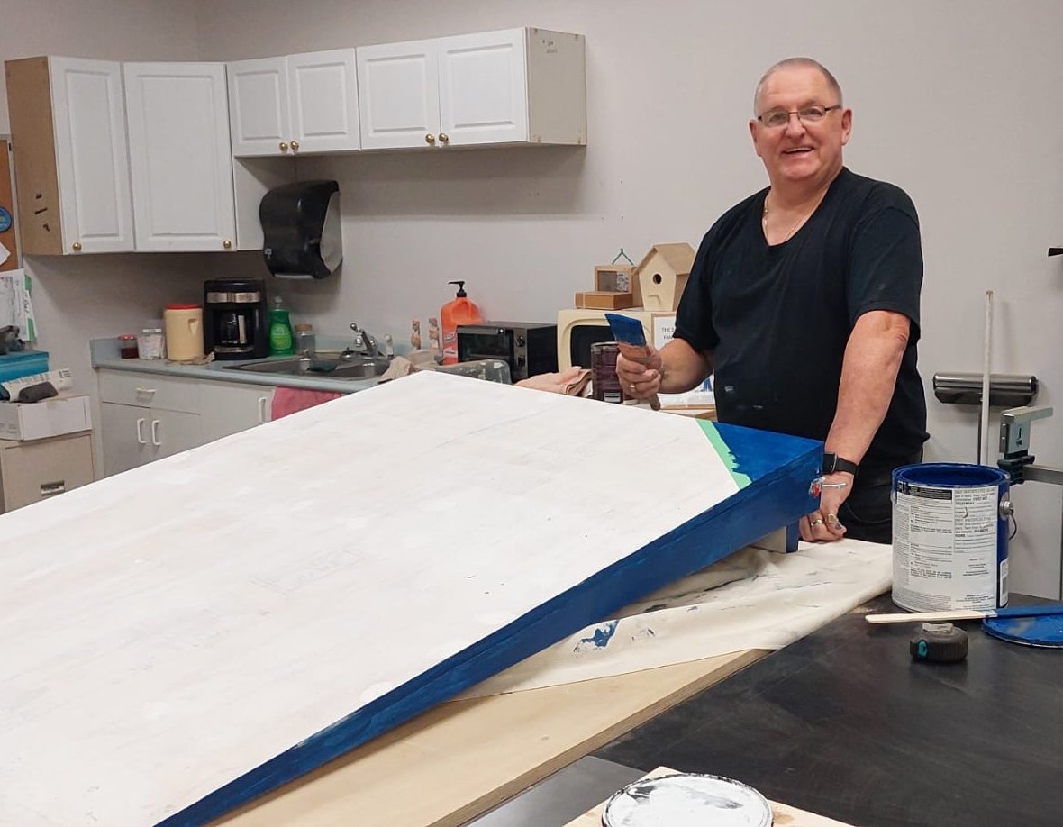 A member works on a ramp build.